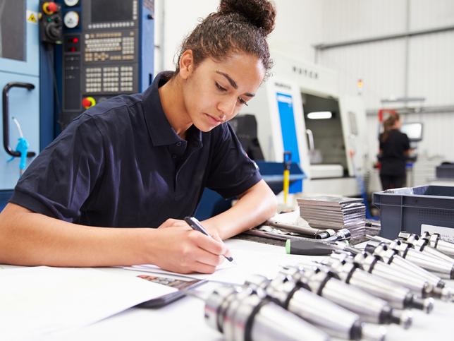 Young woman works on engineering planning project, contextual learning, HELF