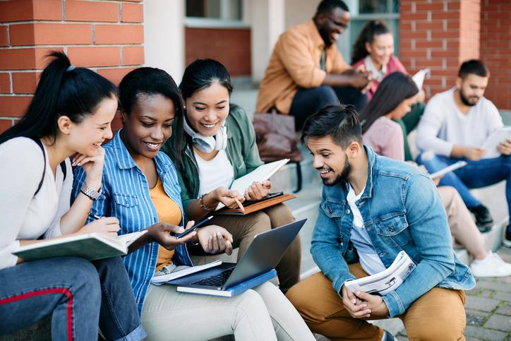 Students discuss class material on university campus