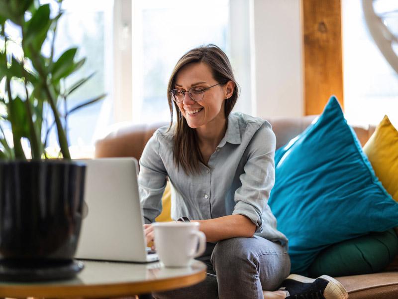 Woman at home on laptop