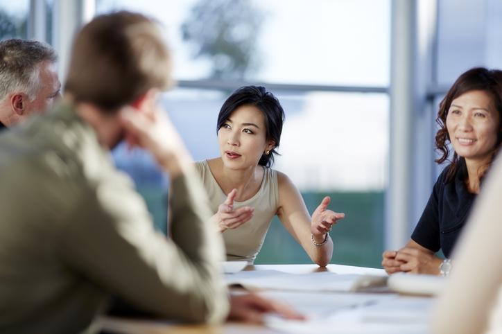 A team of colleagues in discussion in a meeting