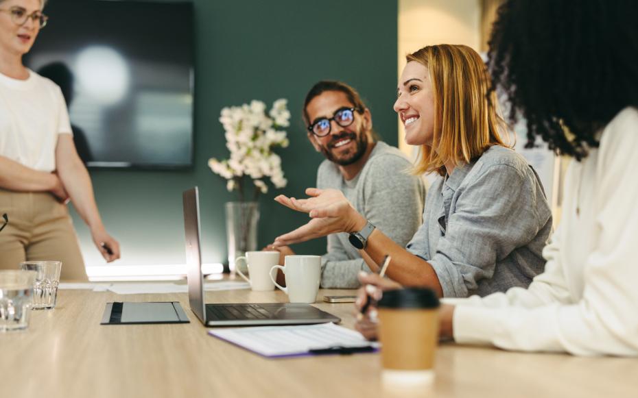 People in an office collaborating on a project