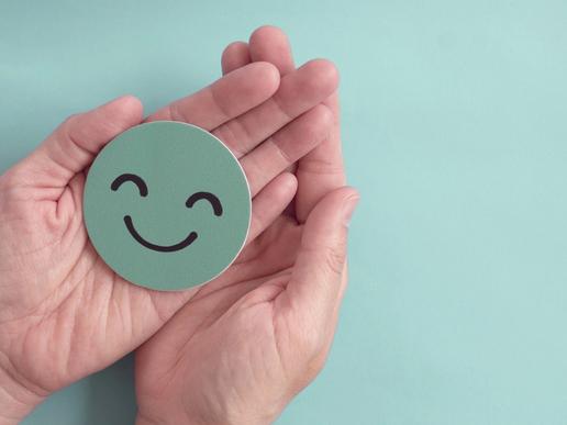 smiley face on head cut-out in hands