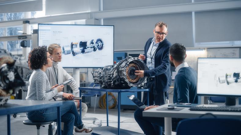 A group of researchers discusses a prototype