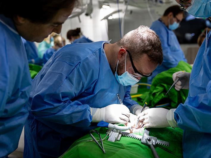 Doctors performing heart surgery