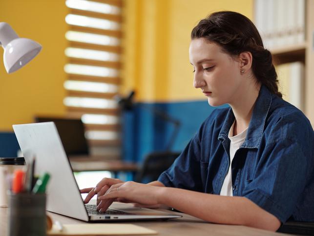 female student working on laptop