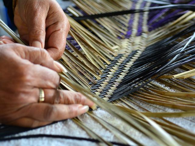 Maori woman weaving