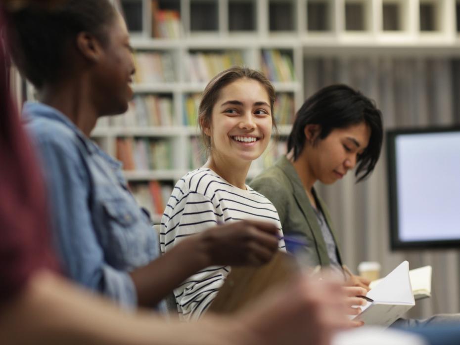 Student in class smiling to camera