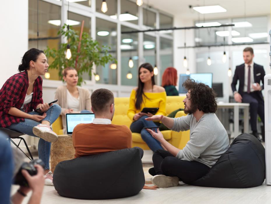 Business students discussing a case study in class