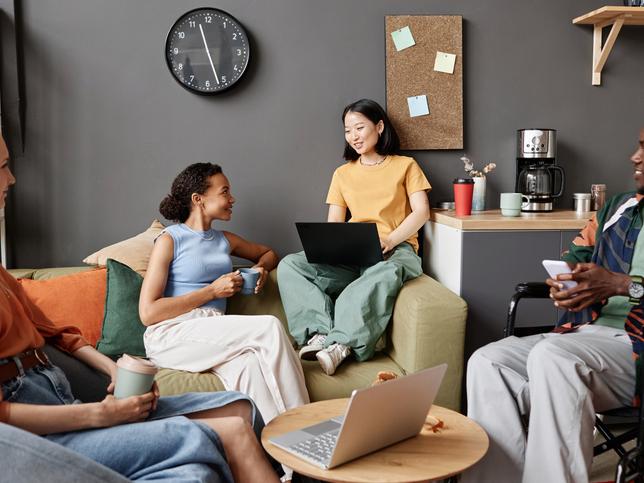 Members of Gen Z work in an office lounge