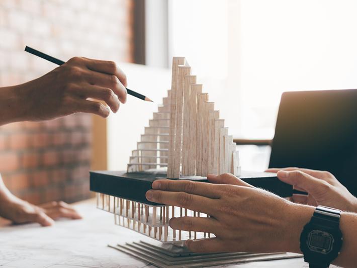 Architects working on a model