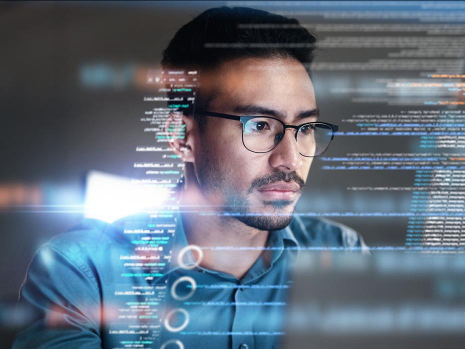 A student in front of a screen coding