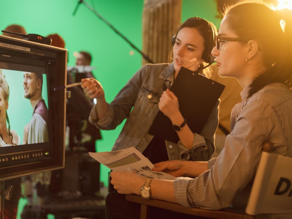 Female director supervising a film shoot