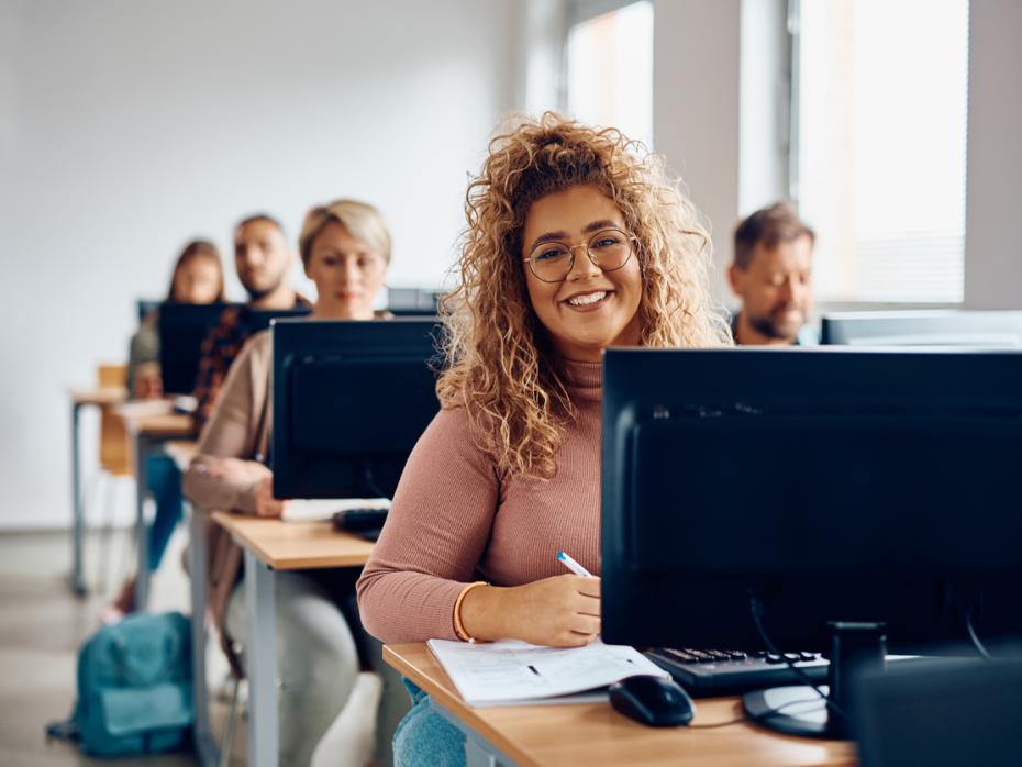 Student sitting at her desk in front of a computer