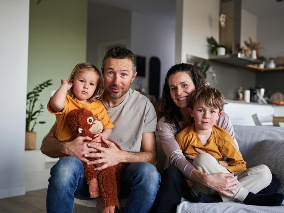 Parents with two sons posing for a photo