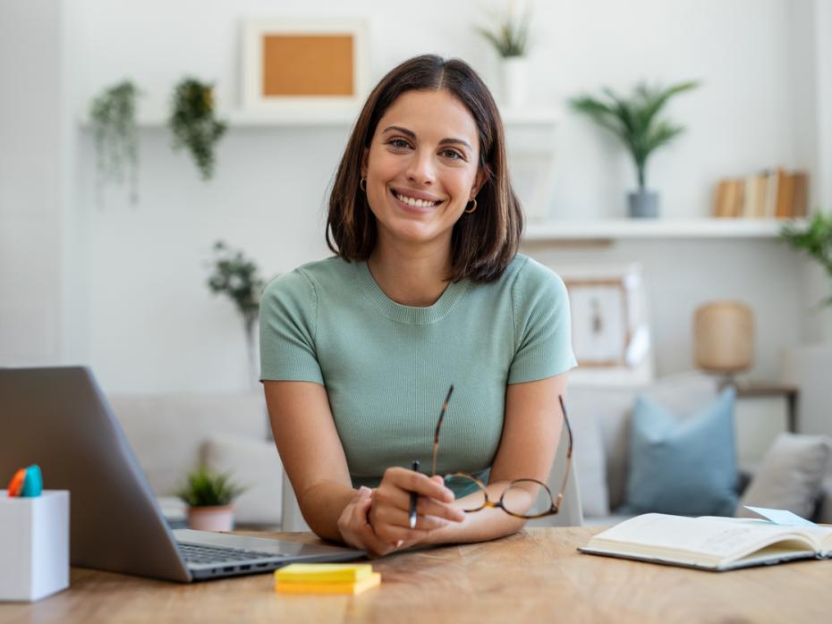 Business woman on her laptop in her living room