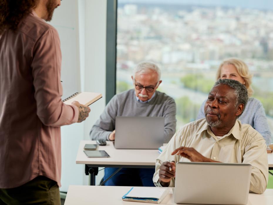 Older students at their desks at a university