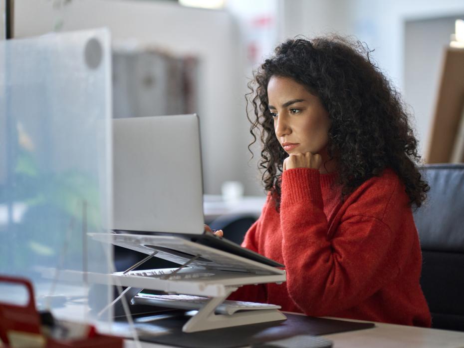 A female student working on her laptop