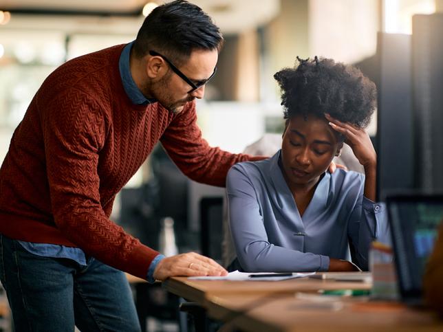 An educator comforts a distressed student