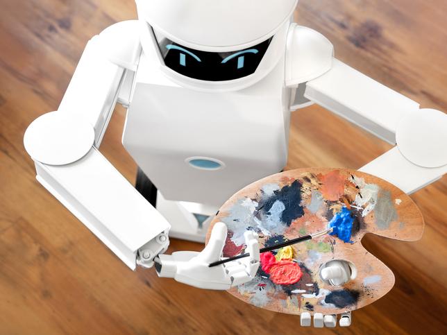 A robot holds a paint-splattered easel