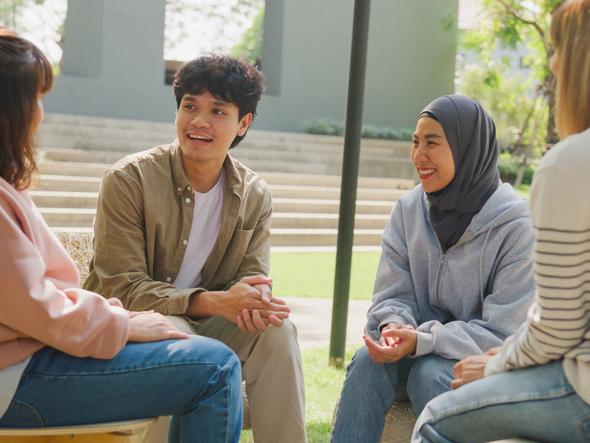 A group of students sat in a circle having a discussion