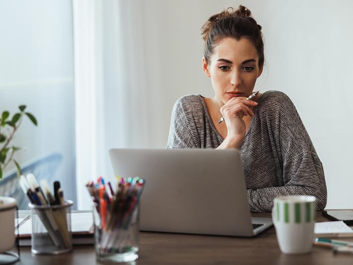 Young woman working at laptop