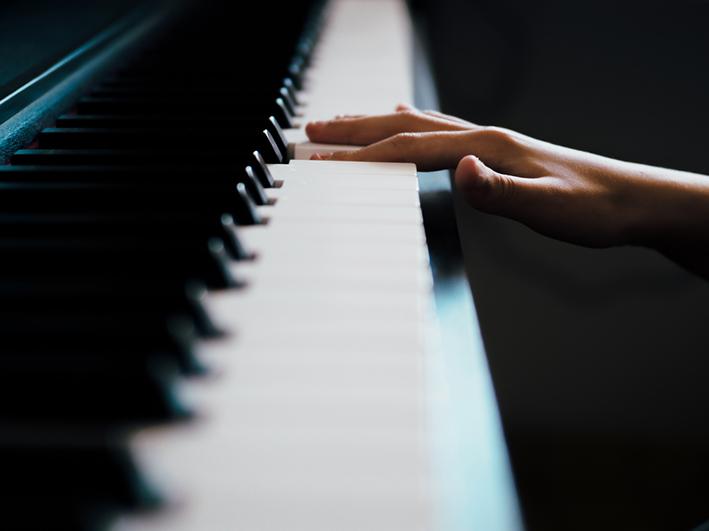 Hand playing piano