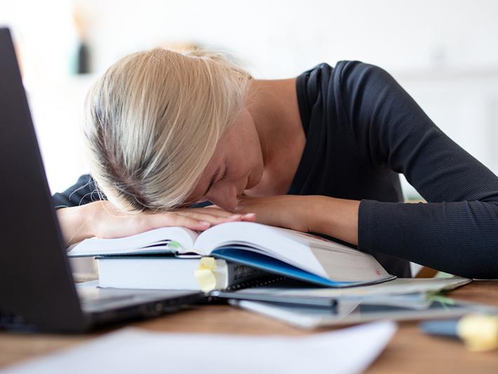 Woman sleeping at desk