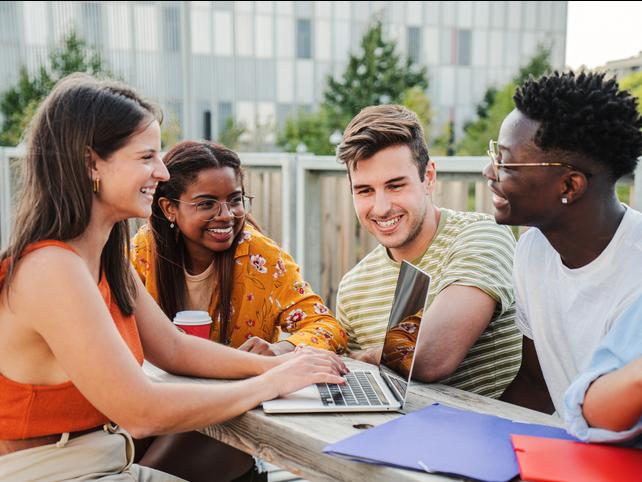 Students work together in an outdoor setting