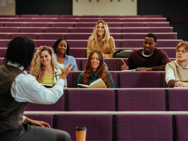 Students talk with their lecturer 