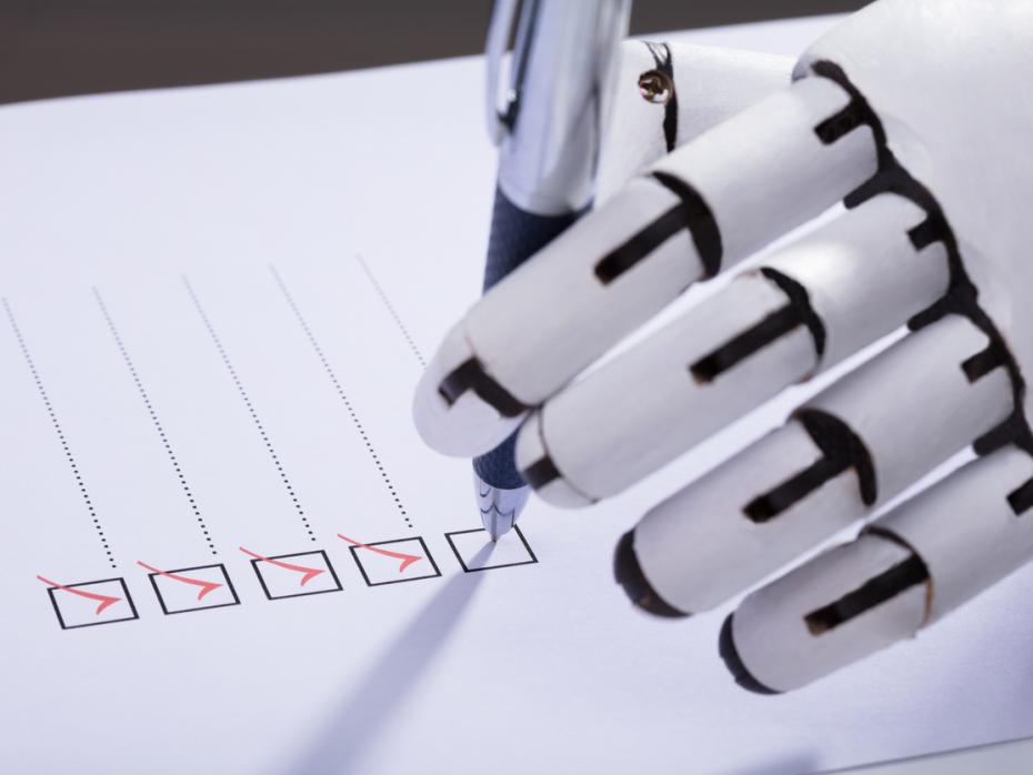 A robot hand ticking check boxes on a piece of paper