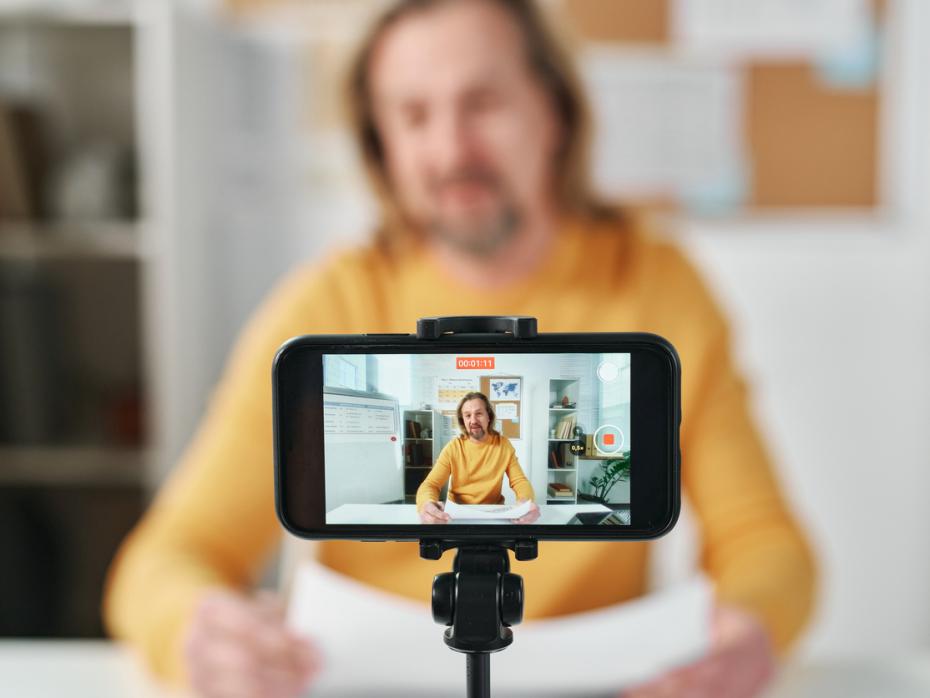 A teacher live streaming from a smart phone