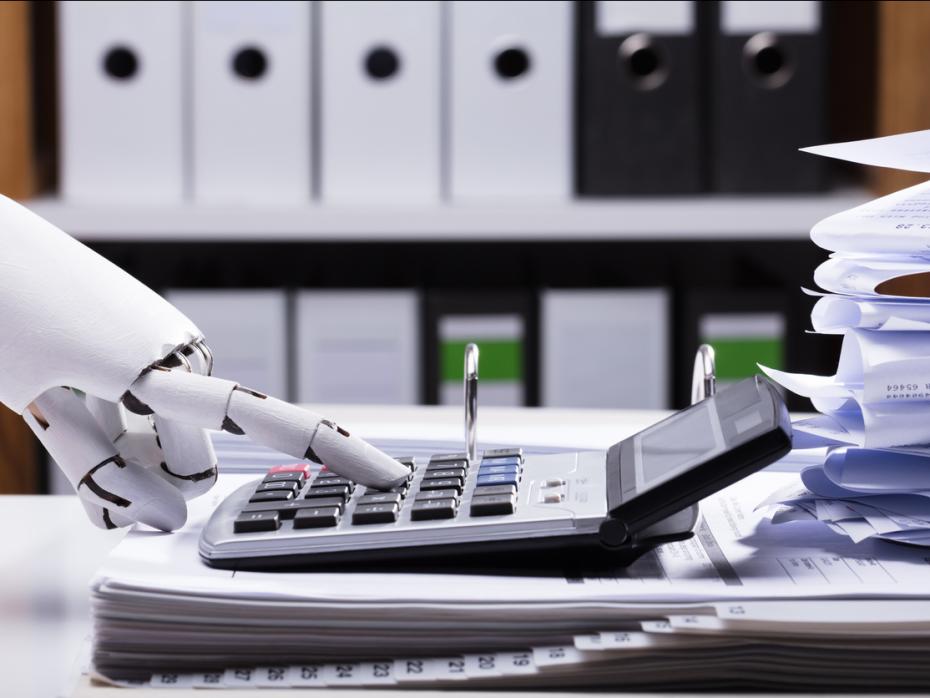 A robot hand using a calculator