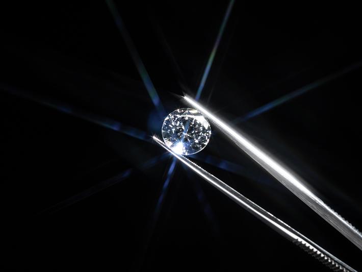 Diamond held in tweezers