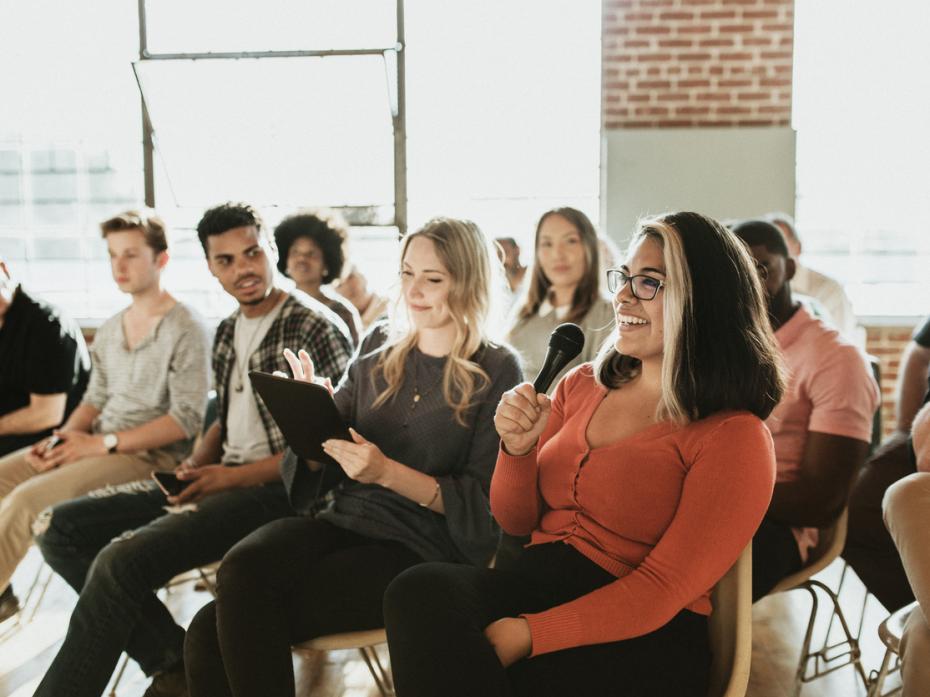 Students speaking at a meeting.