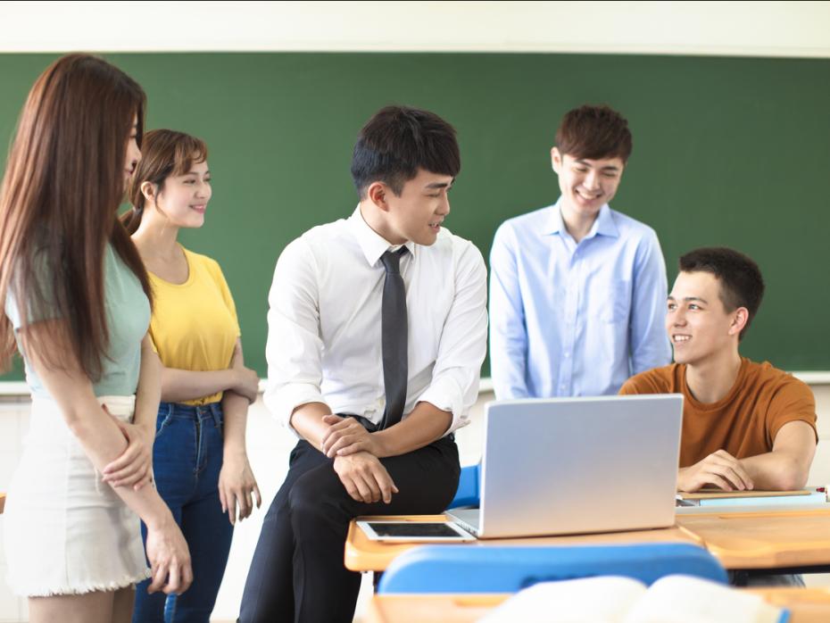 A teacher with students in a classroom