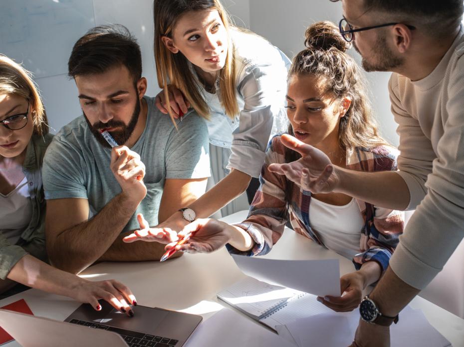 Students discussing a group project in class