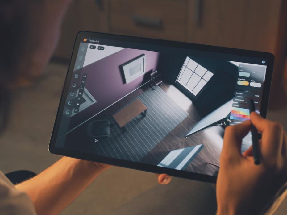 A tablet with a floor plan being held 