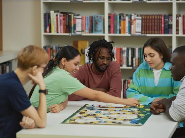 Students playing a boardgame 