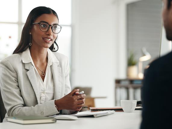 A young woman interviews for a job