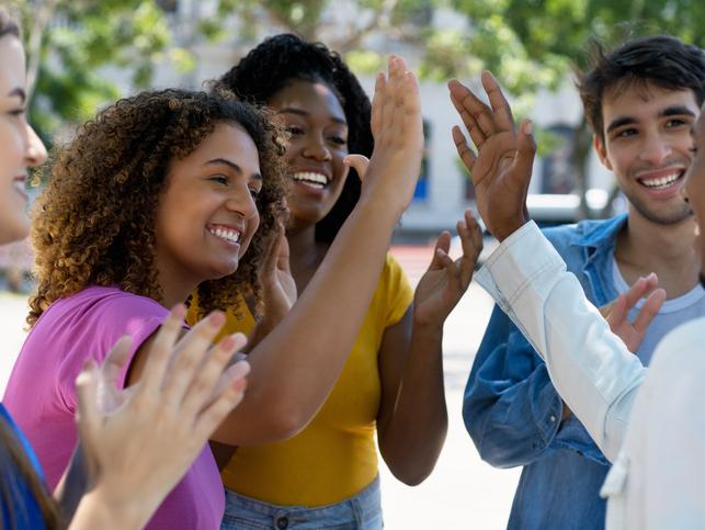 Students high five