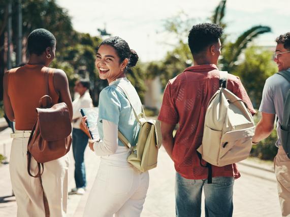 A group of students laugh together