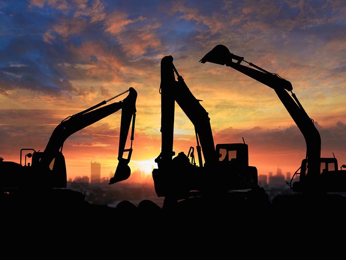 Bulldozers at sunset