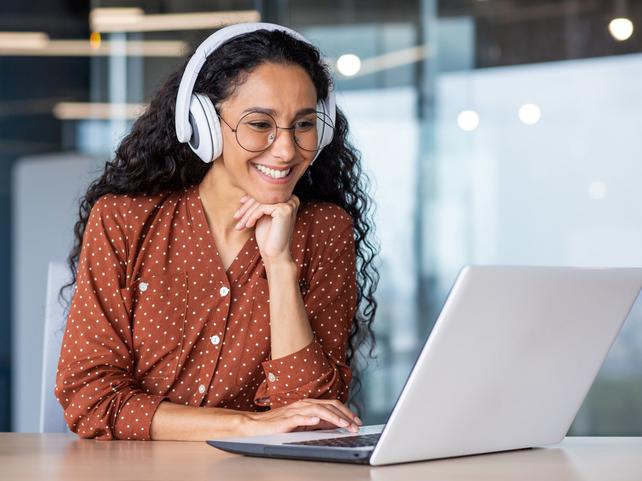A student wears headphones while on a Zoom call