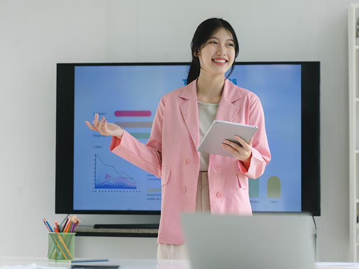 Young Asian female students giving presentation