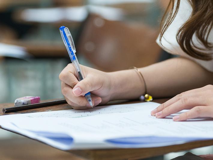 Female student doing handwritten exam