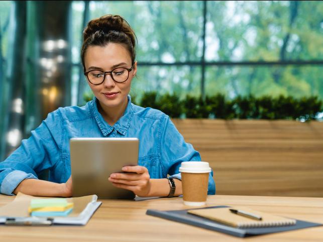 A young entrepreneur works on an iPad