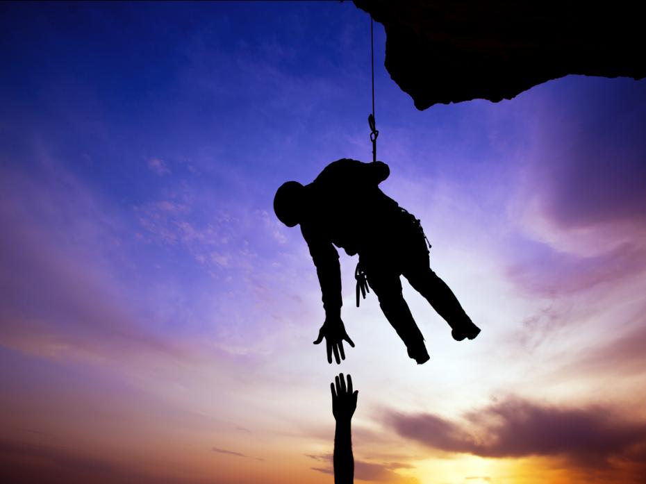 An abseiler catching a falling colleague