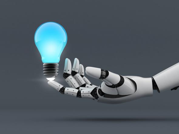 A robot hand holds a lightbulb