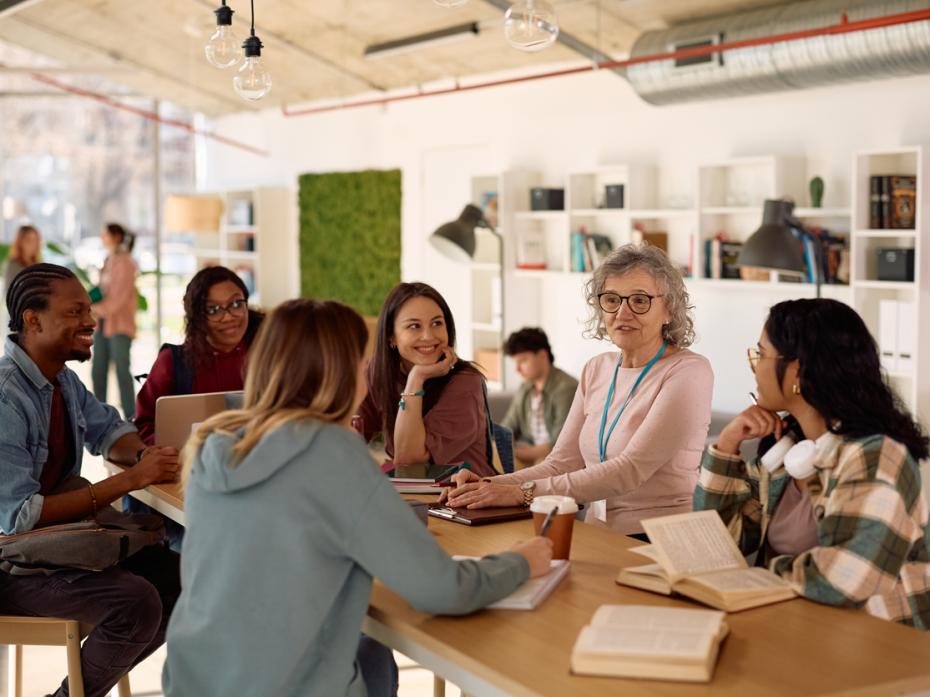 A teacher having a discussion with students