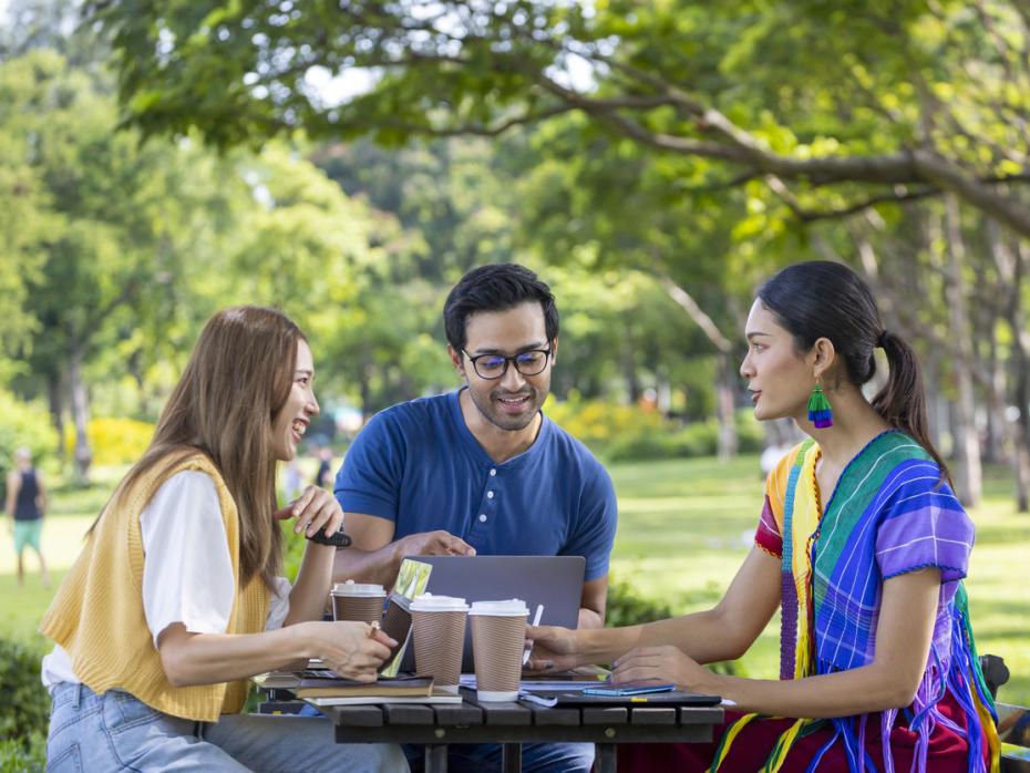Students chatting in a green space